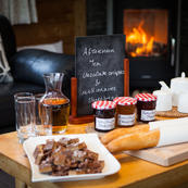 Return to the chalet after skiing for afternoon tea and a roaring fire