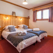 Chalet Charmille is a 'stand alone' chalet built with 3 layers and space for everyone.  This twin ensuite is room 5.